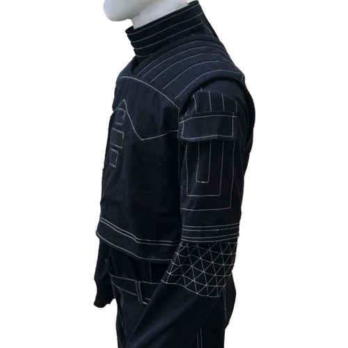 A dark navy blue quilted jacket with white contrast stitching, displayed on a white mannequin torso against a white background.